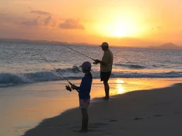 Father and Daughter beach fishing