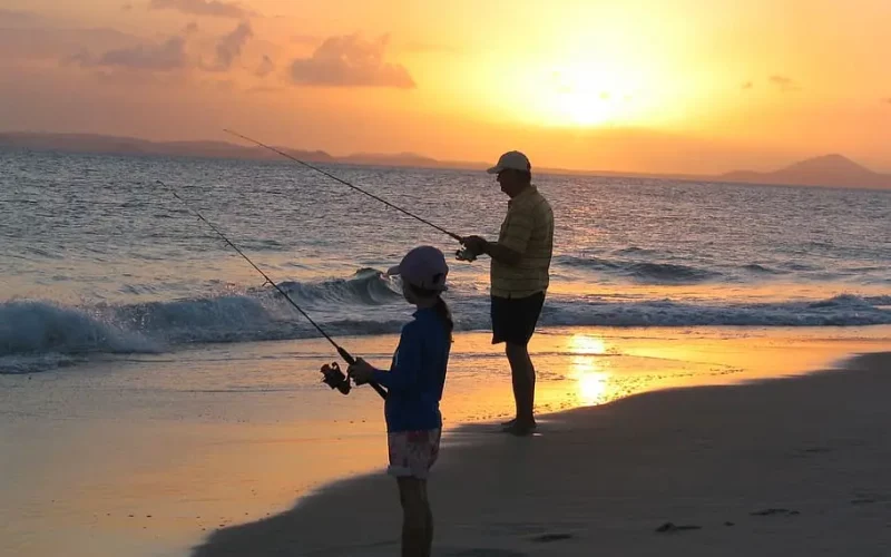 Father and Daughter beach fishing